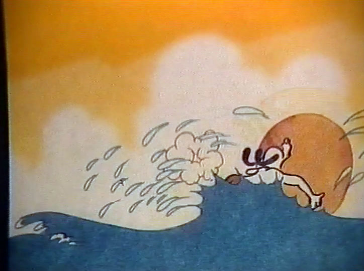 The surfer is thrown off his board in a burst of spray, sun low behind him.