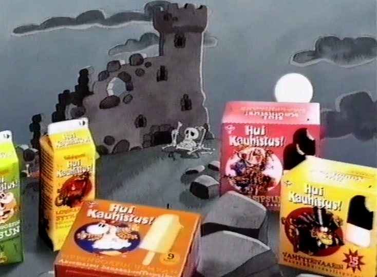 Cartons and boxes lettered Hui Kauhistus stand among the rocks below the ruined castle