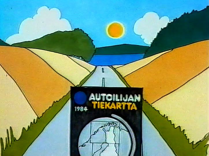 The Autoilijan Tiekartta cover on a road that runs away between hills.
