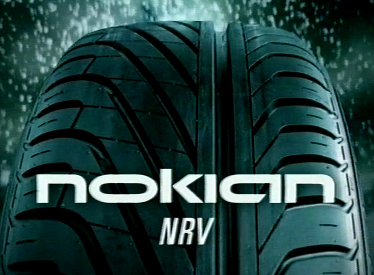 Close view of a wet tyre tread with the nokian NRV wordmark keyed across it