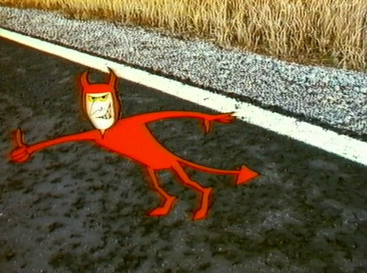 Dumped on the gravel verge by a white road line, the devil sticks out a thumb.