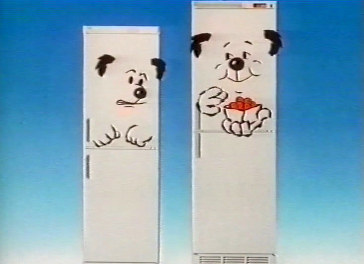 Close on the tall freezer’s face, tongue out, a paw of strawberries at its mouth.