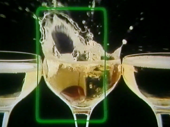Cider pours into a glass while white and pink neon script flashes above it.
