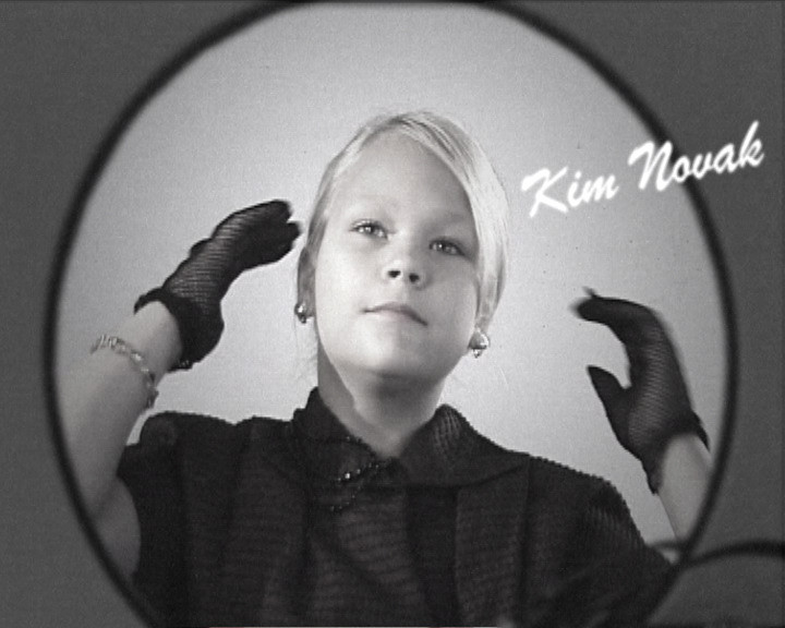 A girl in a black dress and lace gloves poses inside an oval frame, captioned “Kim Novak”.